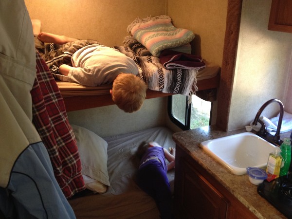 The kids exploring their new bunk beds