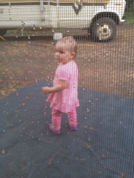 Sasha outside the rPod's tent in the rain.