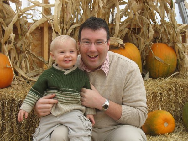 Father and Son in Pumpkin Patch